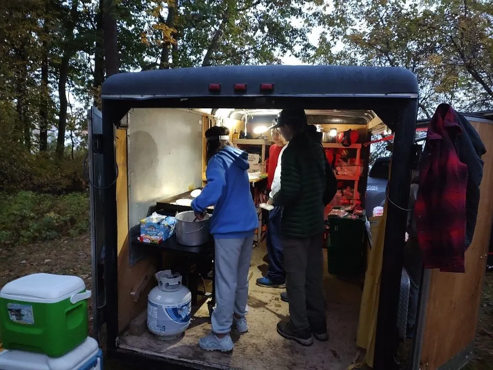 Breakfast underway in the troop's camp kitchen trailer