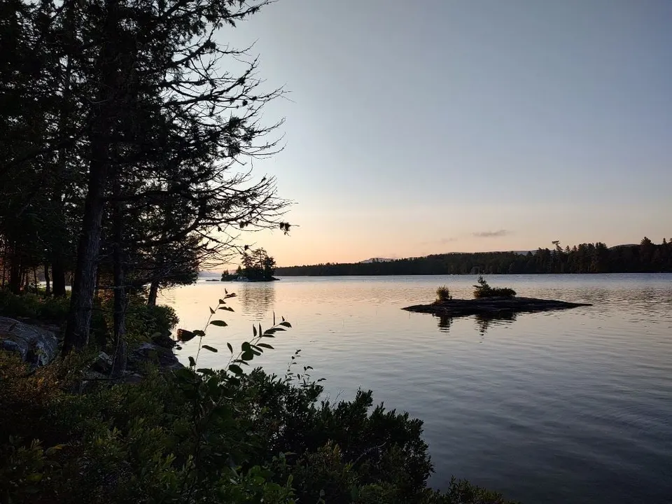 Sunrise over the lake with a small island in the distance