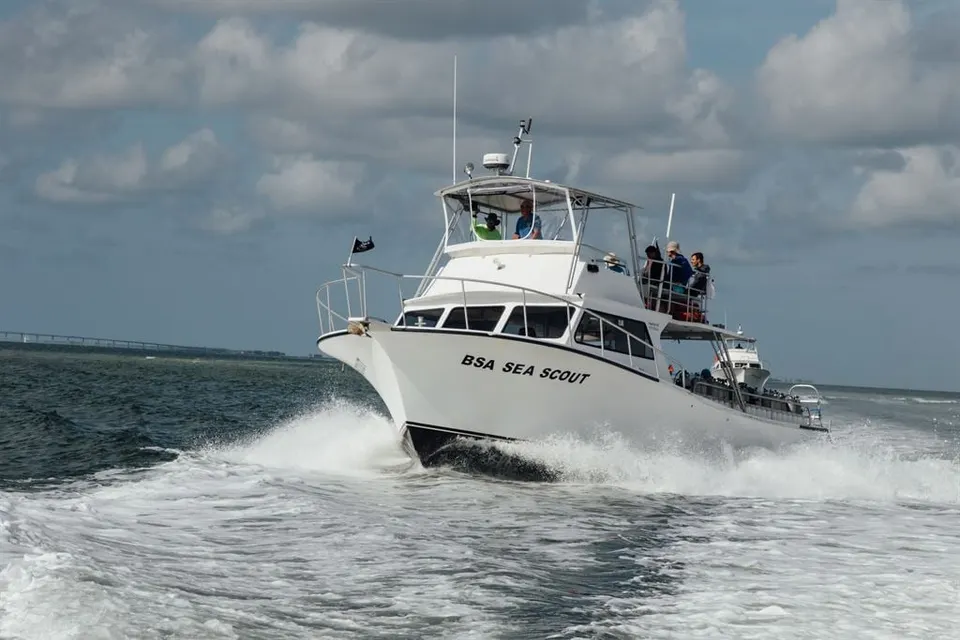A Sea Base dive boat speeding across the water